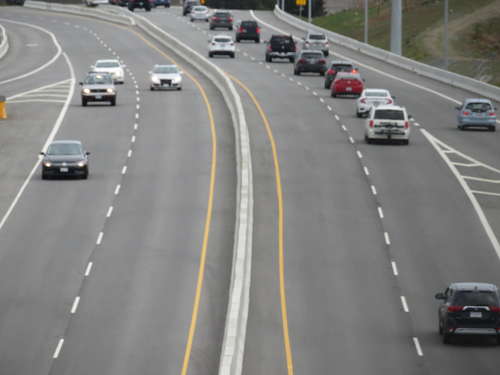 Photo of a busy distorted city view with
                    highway