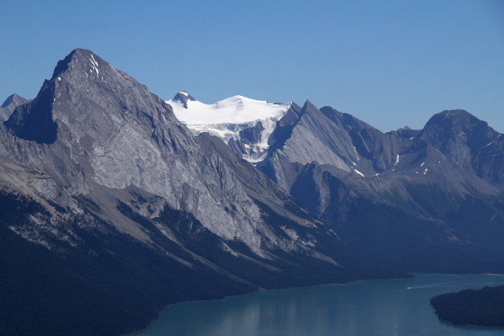 Photo of
                a large lake surrounded by mountains topped with
                snowfields