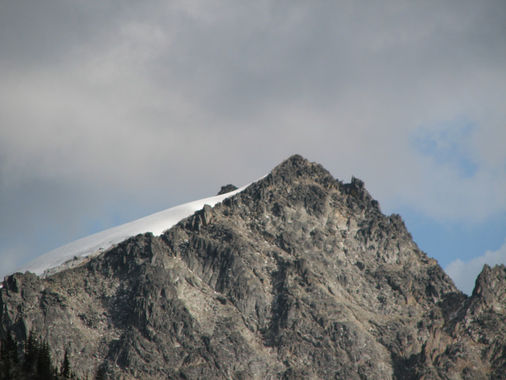 Photo of a
              mountain peak with a snow field just visible on the north
              side
